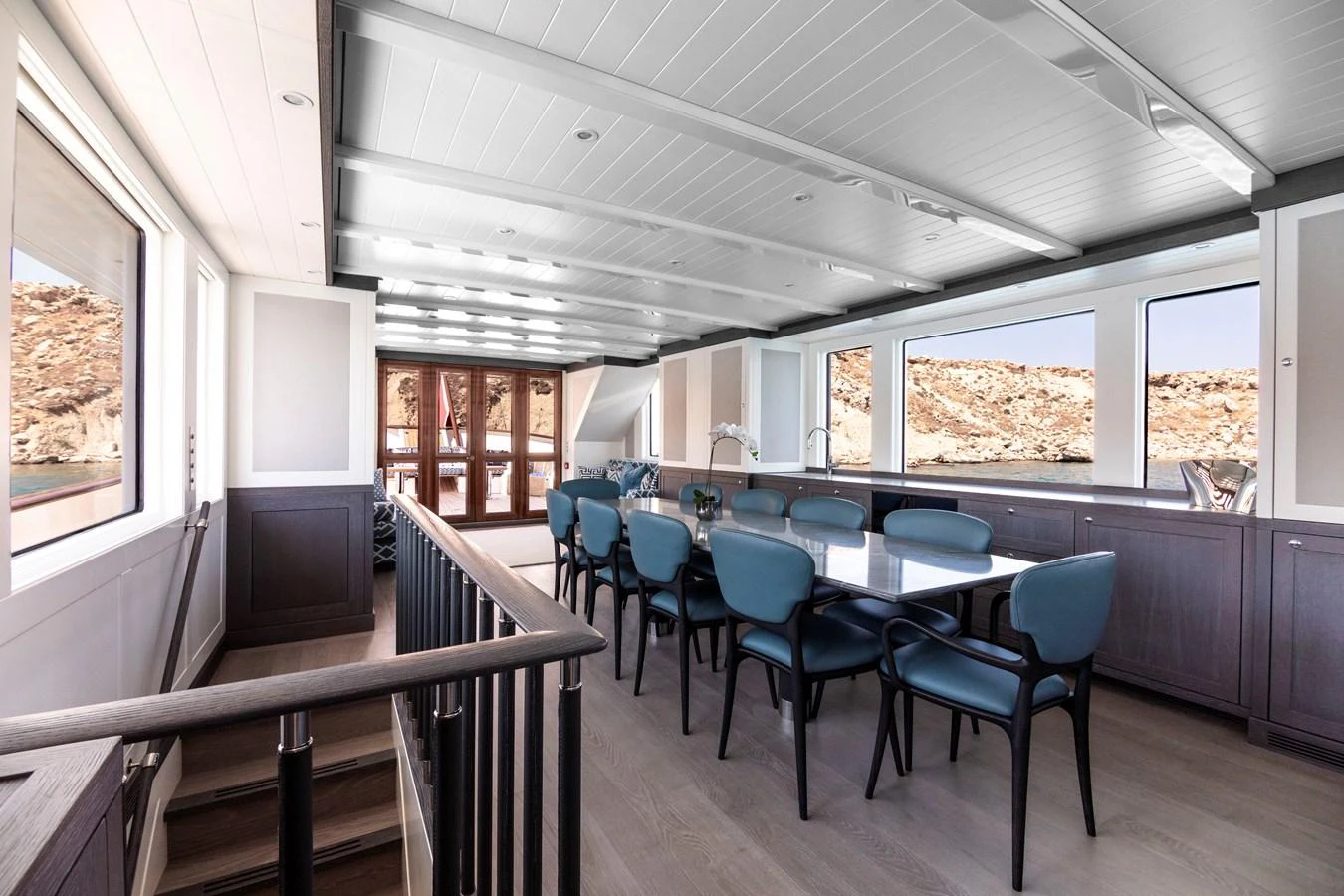 a room with a table and chairs aboard FAR NIENTE Yacht for Sale