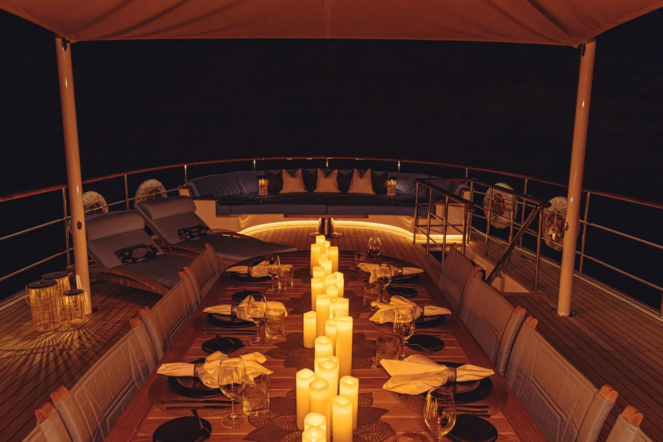 a room with a table and chairs aboard FAR NIENTE Yacht for Sale