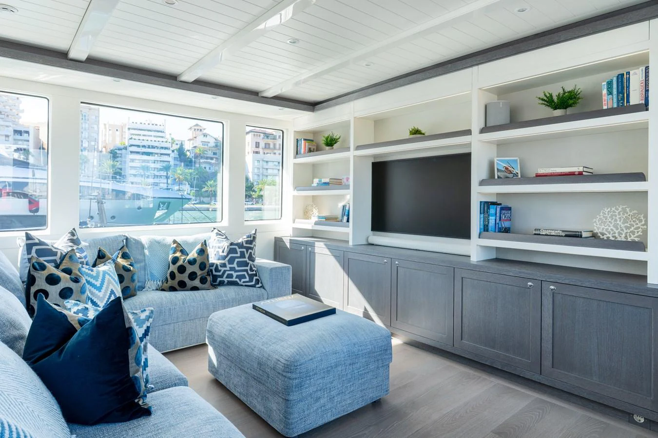 a room with a couch and a tv aboard FAR NIENTE Yacht for Sale