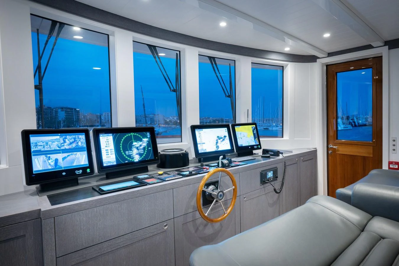 a room with several monitors and a couch aboard FAR NIENTE Yacht for Sale