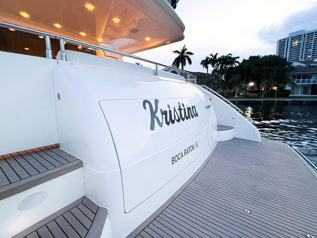 a white boat on a dock aboard ANDREA'S REVENGE Yacht for Sale