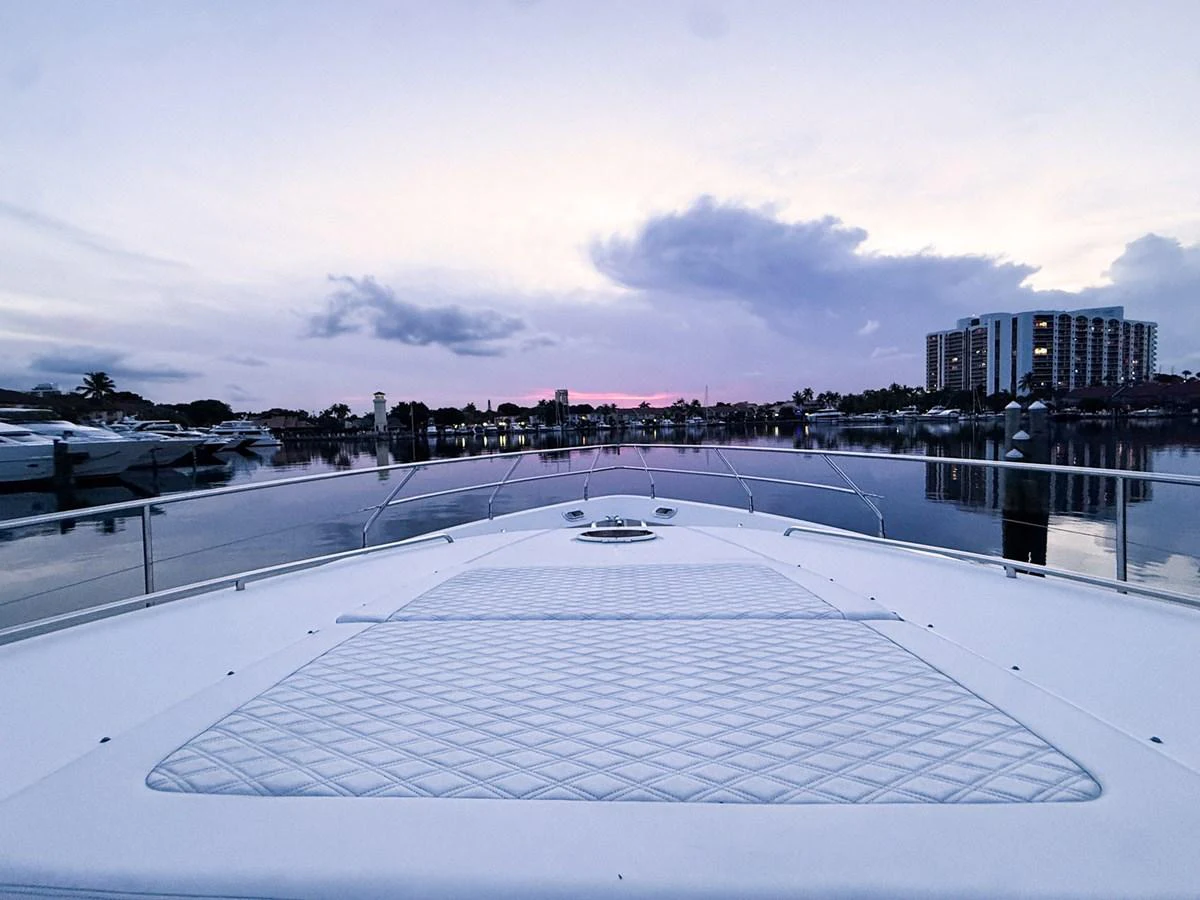 a swimming pool with a city in the background aboard ANDREA'S REVENGE Yacht for Sale