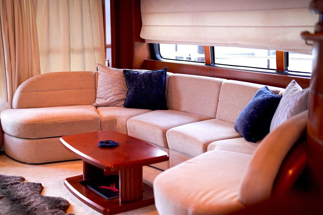 a living room with a couch and a coffee table aboard ANDREA'S REVENGE Yacht for Sale
