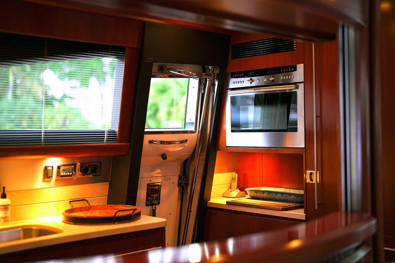 a kitchen with a microwave oven and a stove aboard ANDREA'S REVENGE Yacht for Sale