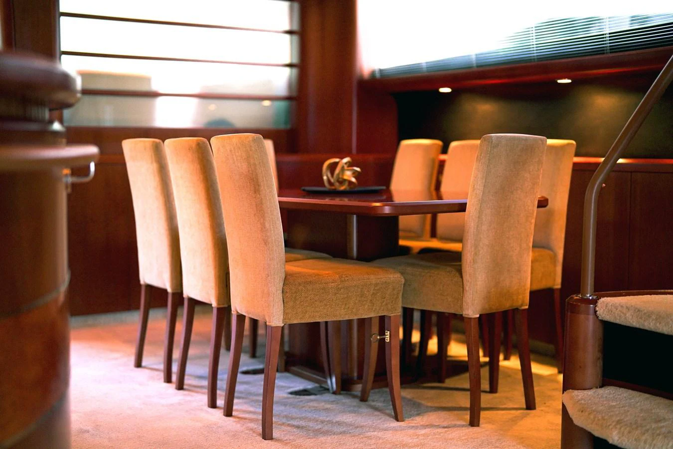 a wooden chair next to a table aboard ANDREA'S REVENGE Yacht for Sale