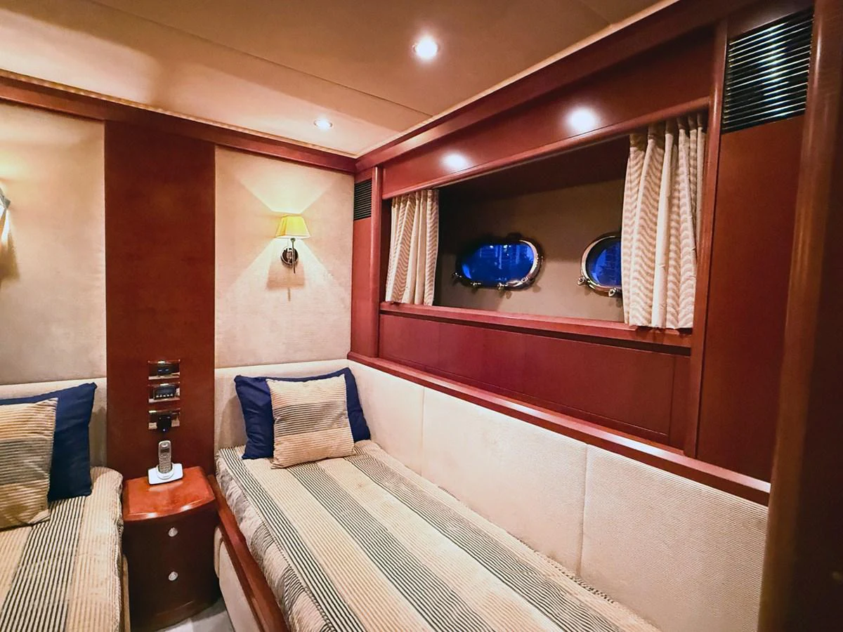 a bed with a mirror above it aboard ANDREA'S REVENGE Yacht for Sale