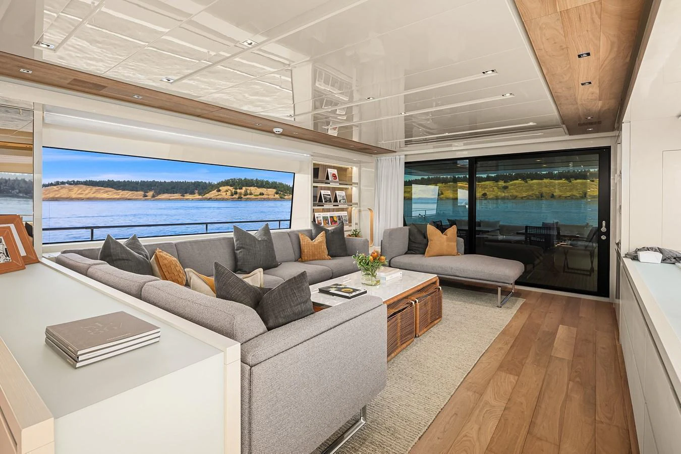 The salon offers a spacious and elegant seating area with panoramic views of the water. aboard ESSENZA Yacht for Sale
