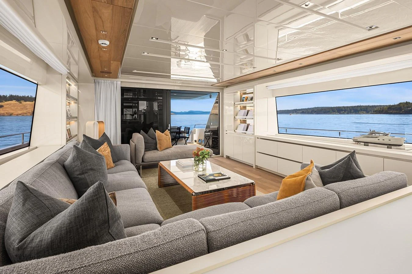 The salon offers a spacious and elegant seating area with panoramic views of the sea. aboard ESSENZA Yacht for Sale