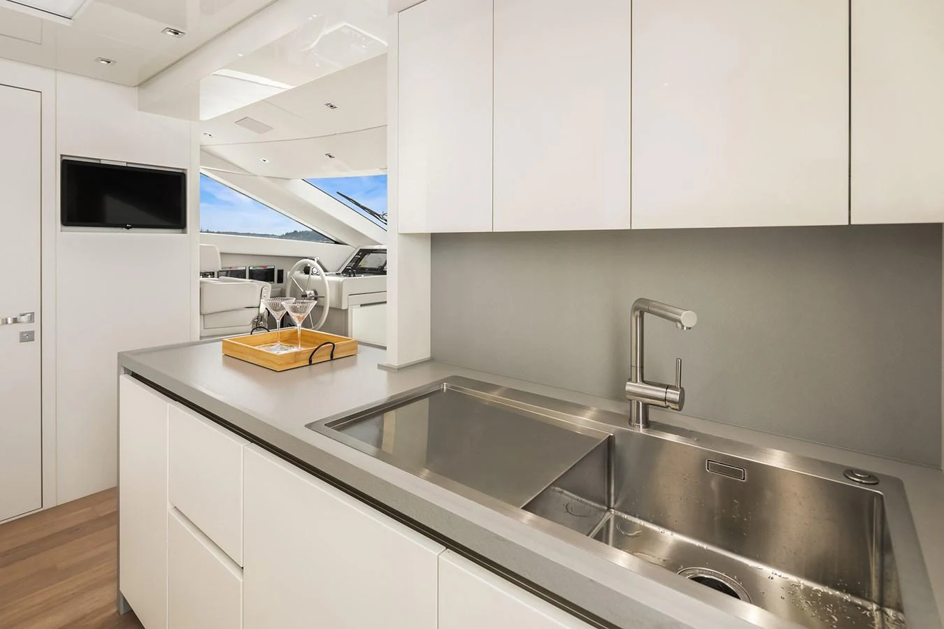 The yacht's galley features modern appliances and a sleek design, perfect for gourmet cooking. aboard ESSENZA Yacht for Sale