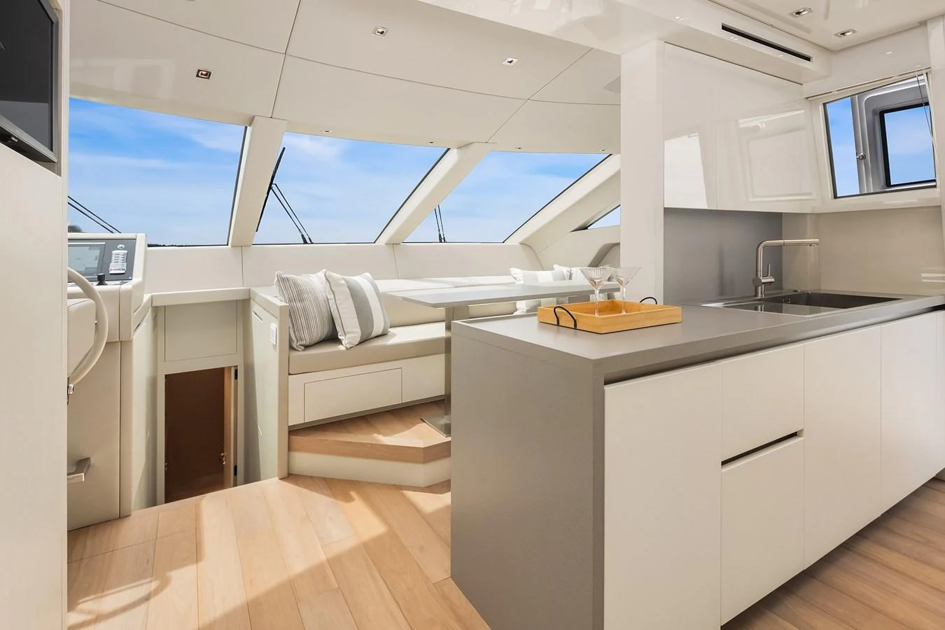 The yacht's galley is modern and bright, featuring sleek cabinetry and ample natural light. aboard ESSENZA Yacht for Sale