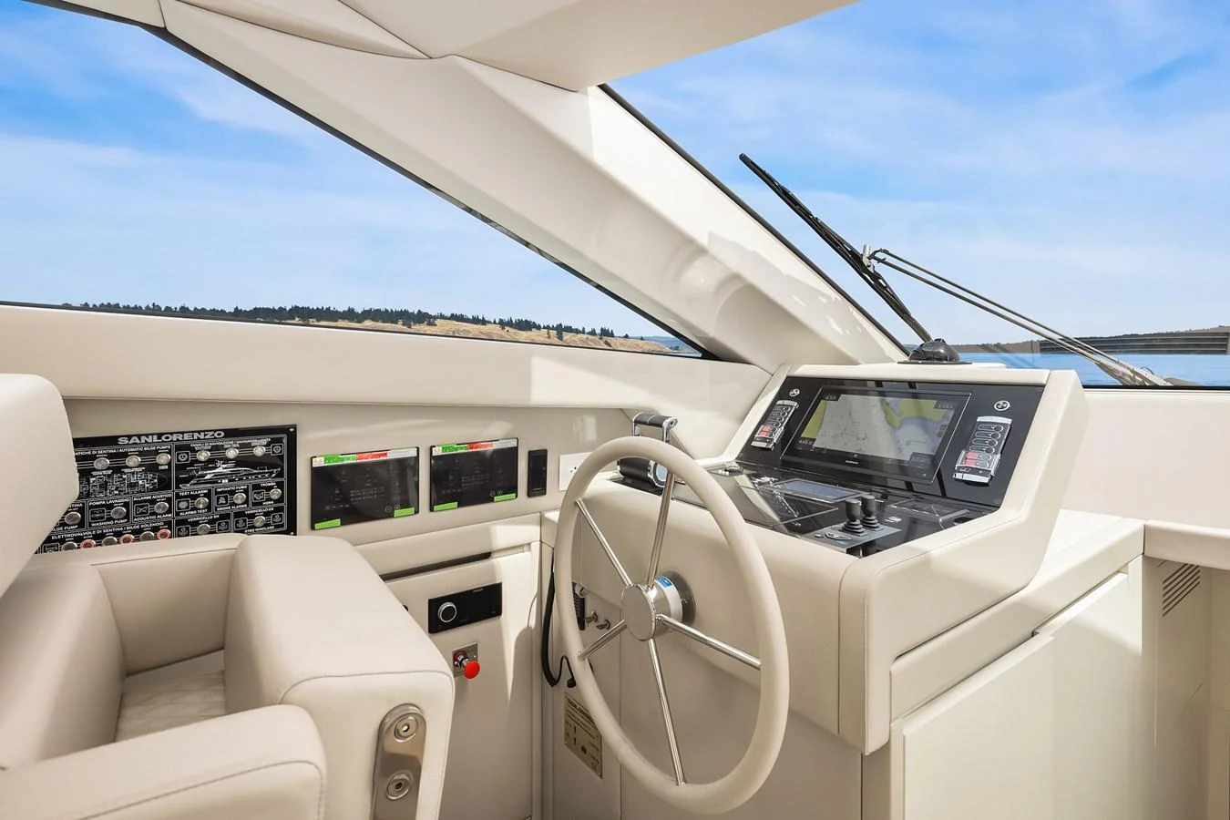 The helm station features modern navigation equipment and a comfortable captain's chair. aboard ESSENZA Yacht for Sale