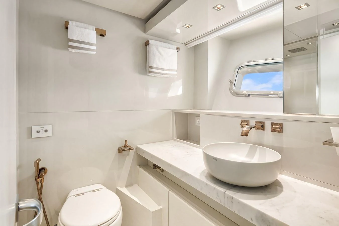 The yacht's bathroom features a sleek, modern design with luxurious fixtures and ample natural light. aboard ESSENZA Yacht for Sale