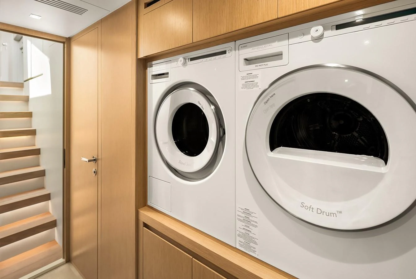 The yacht features a modern laundry room with state-of-the-art appliances. aboard ESSENZA Yacht for Sale