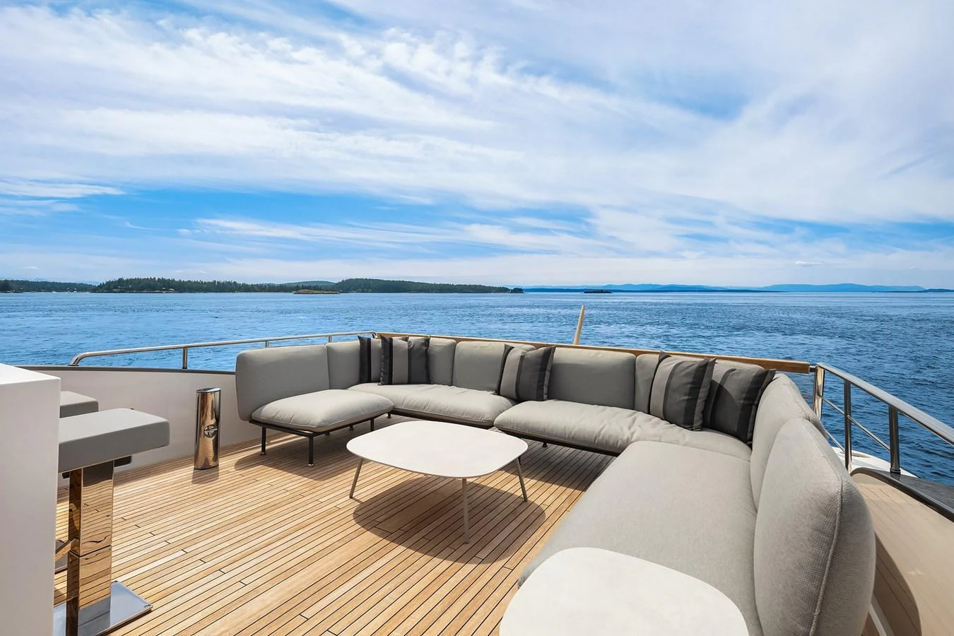 The aft deck features a spacious and comfortable seating area with stunning ocean views. aboard ESSENZA Yacht for Sale