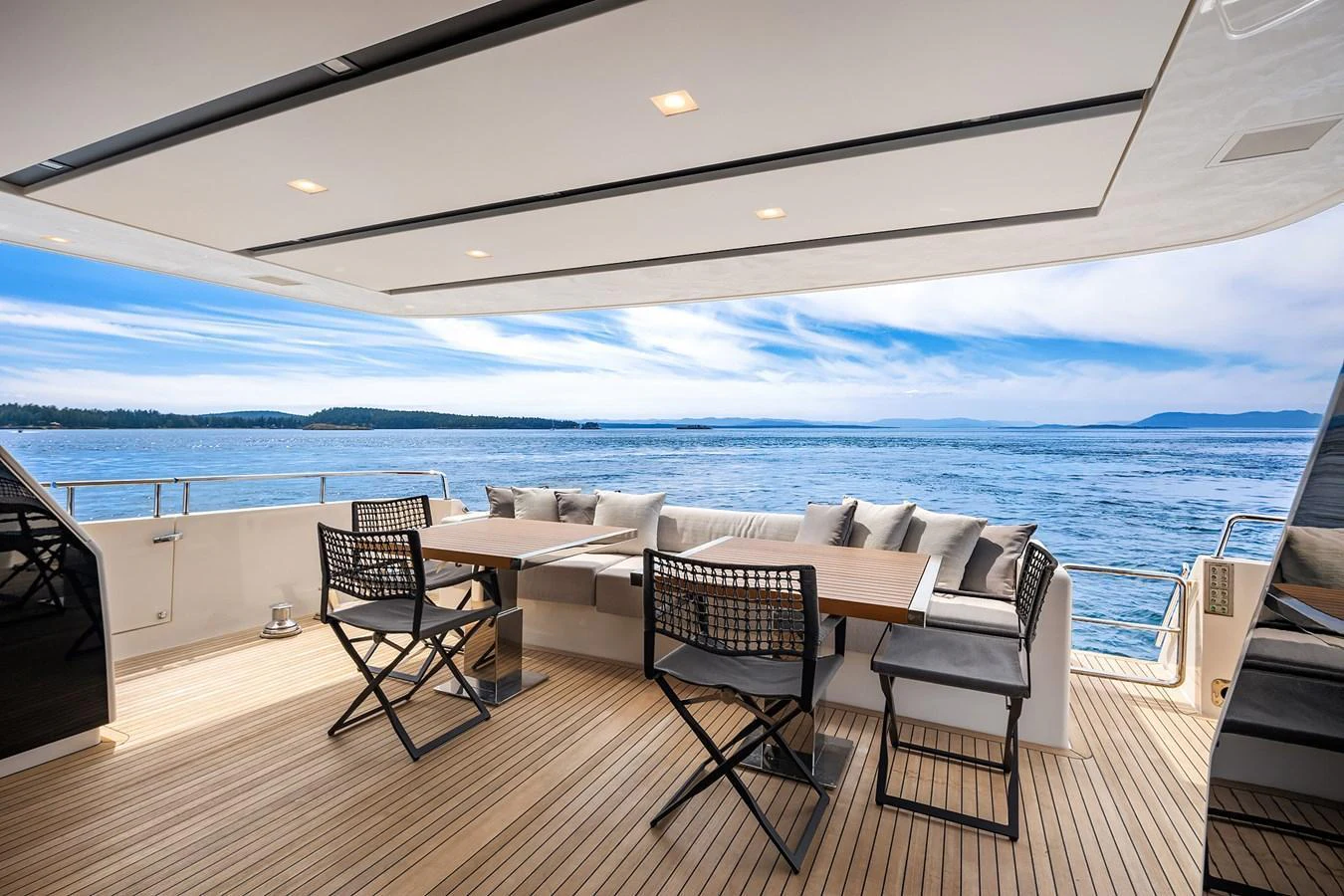 The aft deck offers a spacious and inviting area for alfresco dining with stunning ocean views. aboard ESSENZA Yacht for Sale