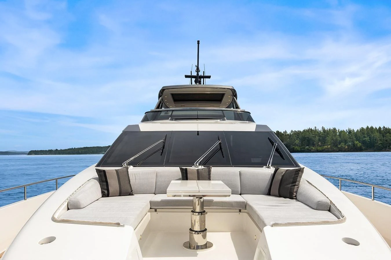 The yacht's foredeck features a spacious seating area with a central table, perfect for relaxation and socializing. aboard ESSENZA Yacht for Sale