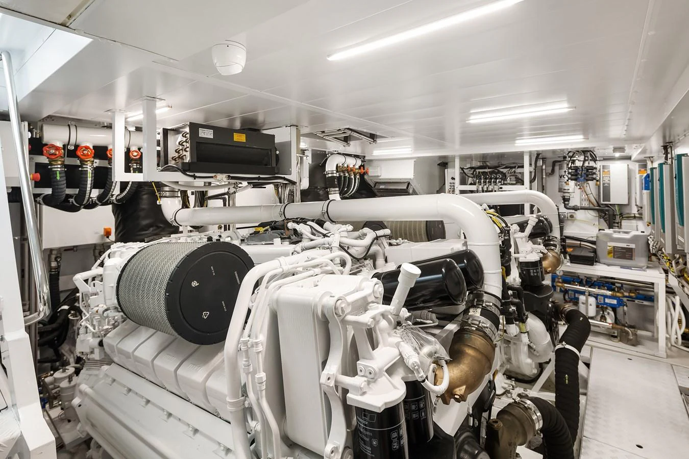 The engine room showcases advanced machinery and a pristine, organized layout. aboard ESSENZA Yacht for Sale