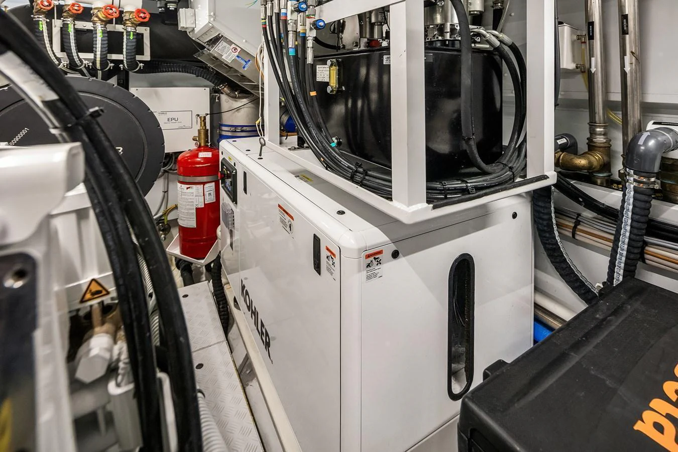 The image showcases the yacht's well-organized engine room with various technical equipment. aboard ESSENZA Yacht for Sale