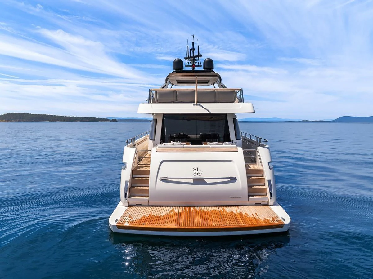 The yacht's aft deck is beautifully showcased against a serene ocean backdrop. aboard ESSENZA Yacht for Sale