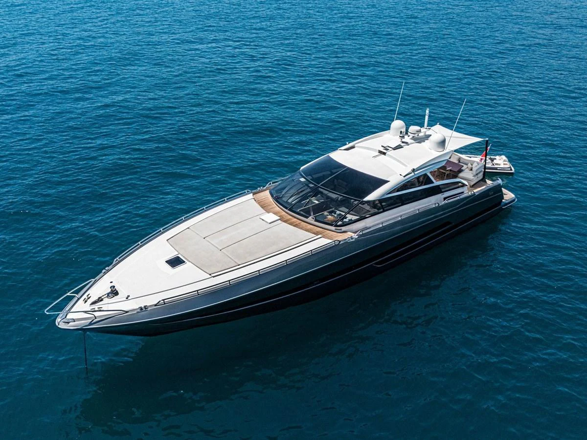 A sleek and modern yacht glides gracefully on calm blue waters. aboard LIONESS Yacht for Sale