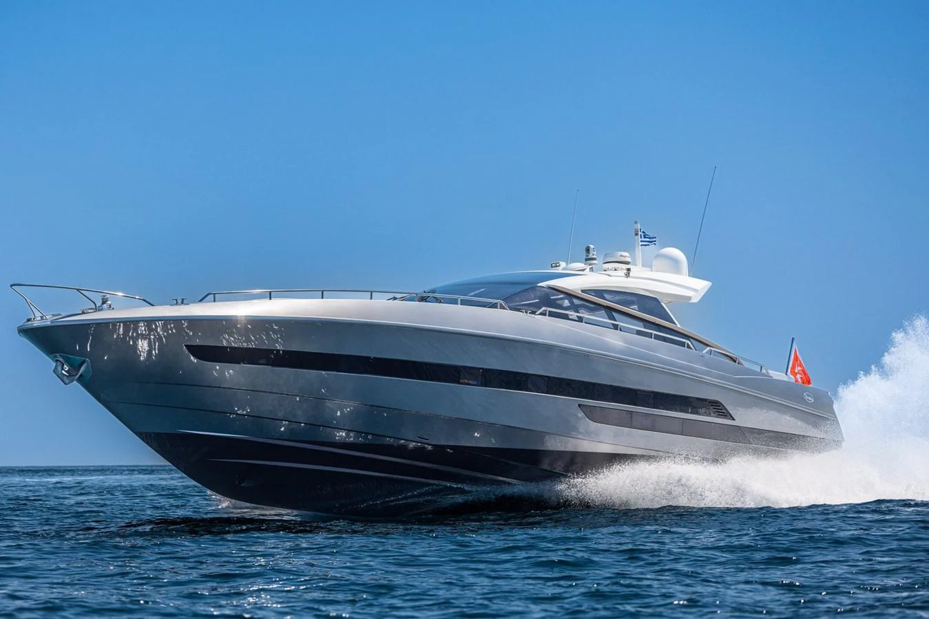 A sleek and modern yacht glides swiftly over the water, showcasing its elegant design and powerful performance. aboard LIONESS Yacht for Sale