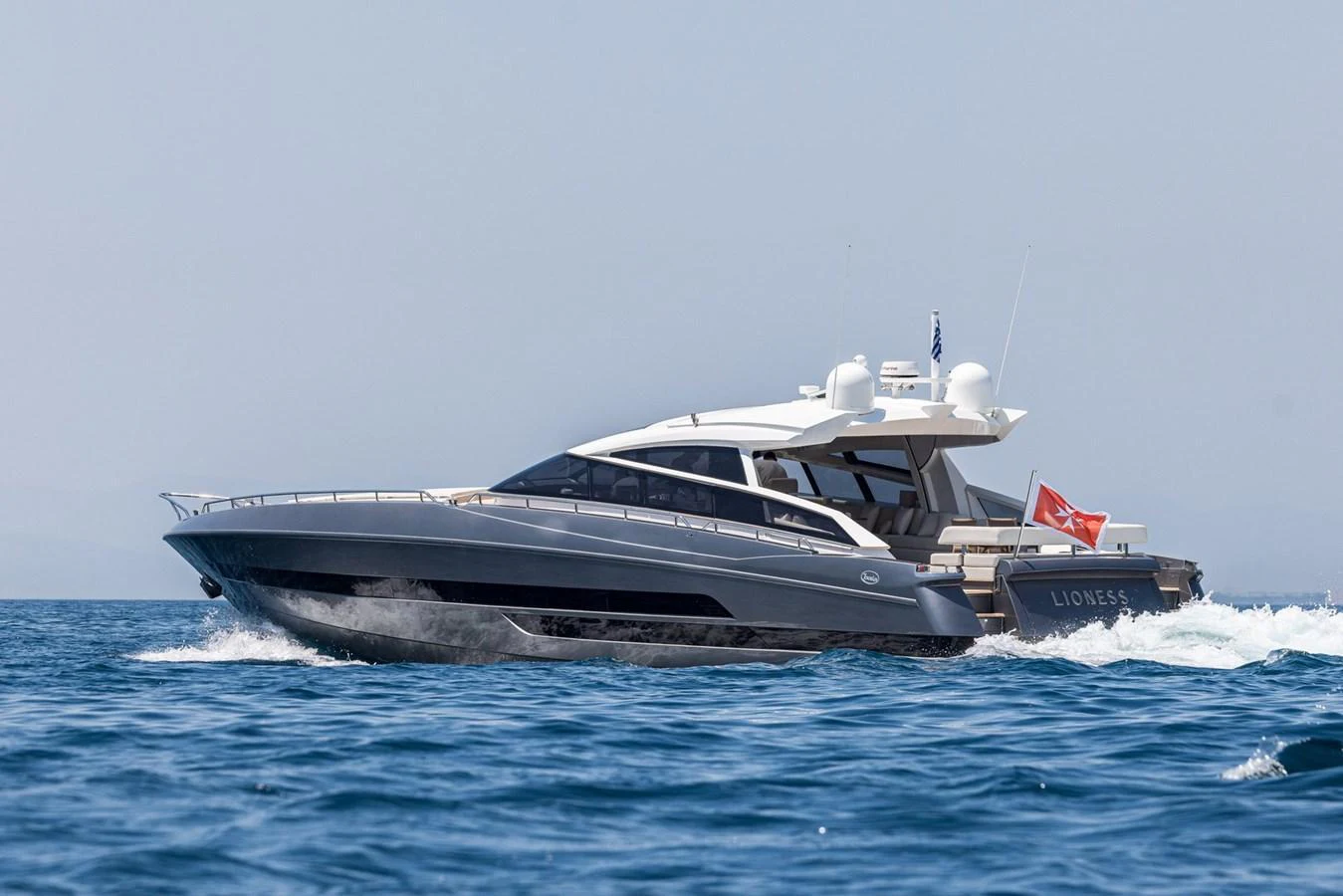 A sleek and modern yacht glides swiftly over the water, showcasing its elegant design and powerful performance. aboard LIONESS Yacht for Sale