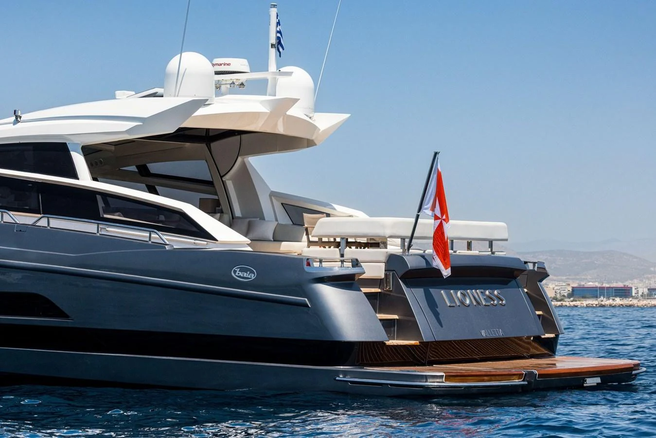 The yacht's sleek aft deck showcases a luxurious and modern design, perfect for relaxing by the water. aboard LIONESS Yacht for Sale