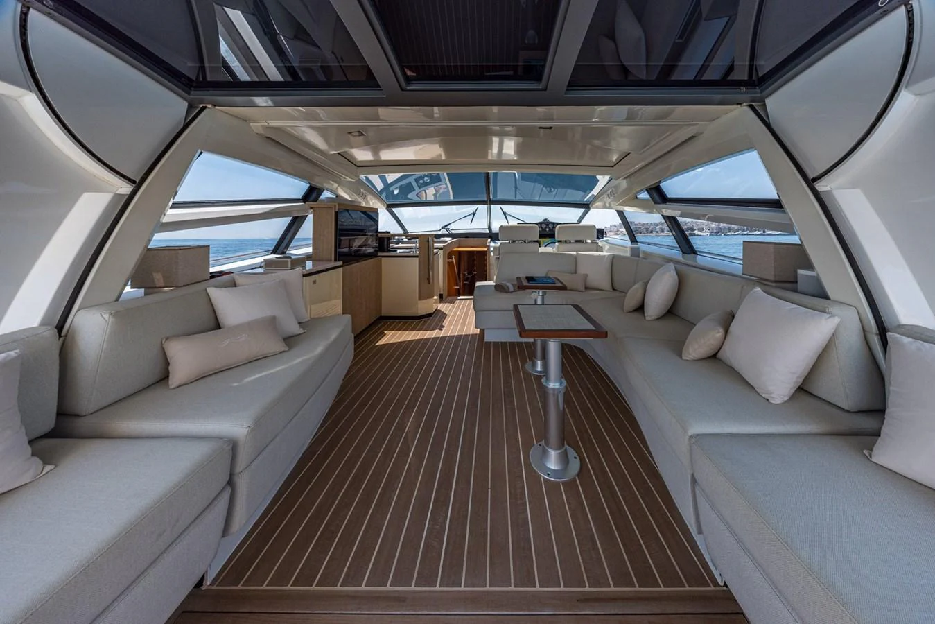 The spacious salon features elegant seating and panoramic views, perfect for relaxation and entertainment. aboard LIONESS Yacht for Sale