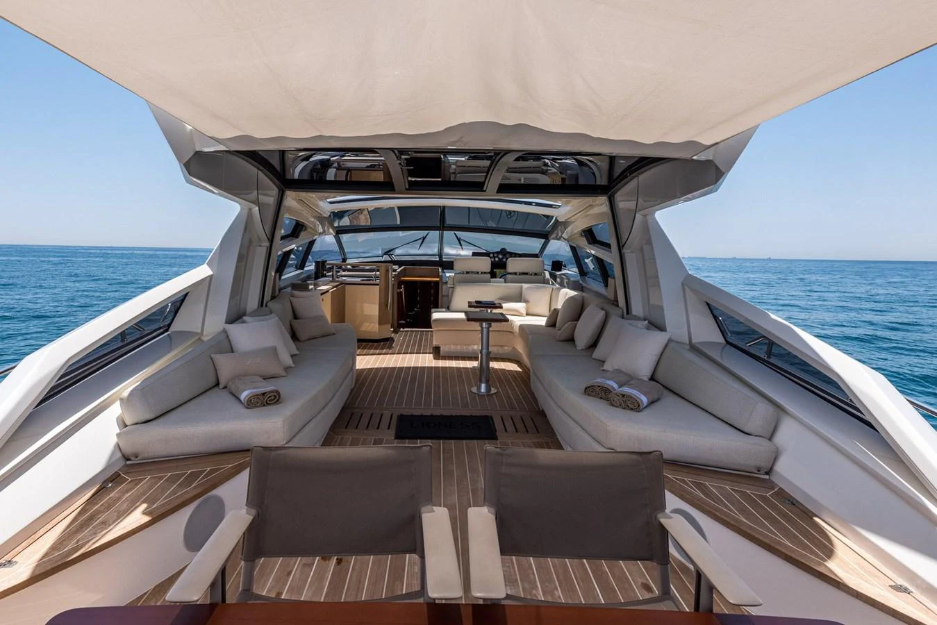 The spacious aft deck offers luxurious seating and a stunning view of the open sea. aboard LIONESS Yacht for Sale