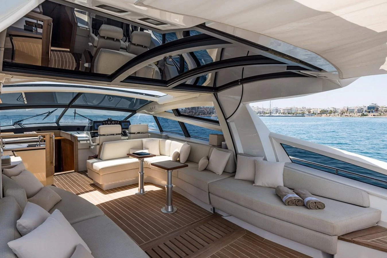 The spacious salon features luxurious seating with panoramic views and modern design. aboard LIONESS Yacht for Sale