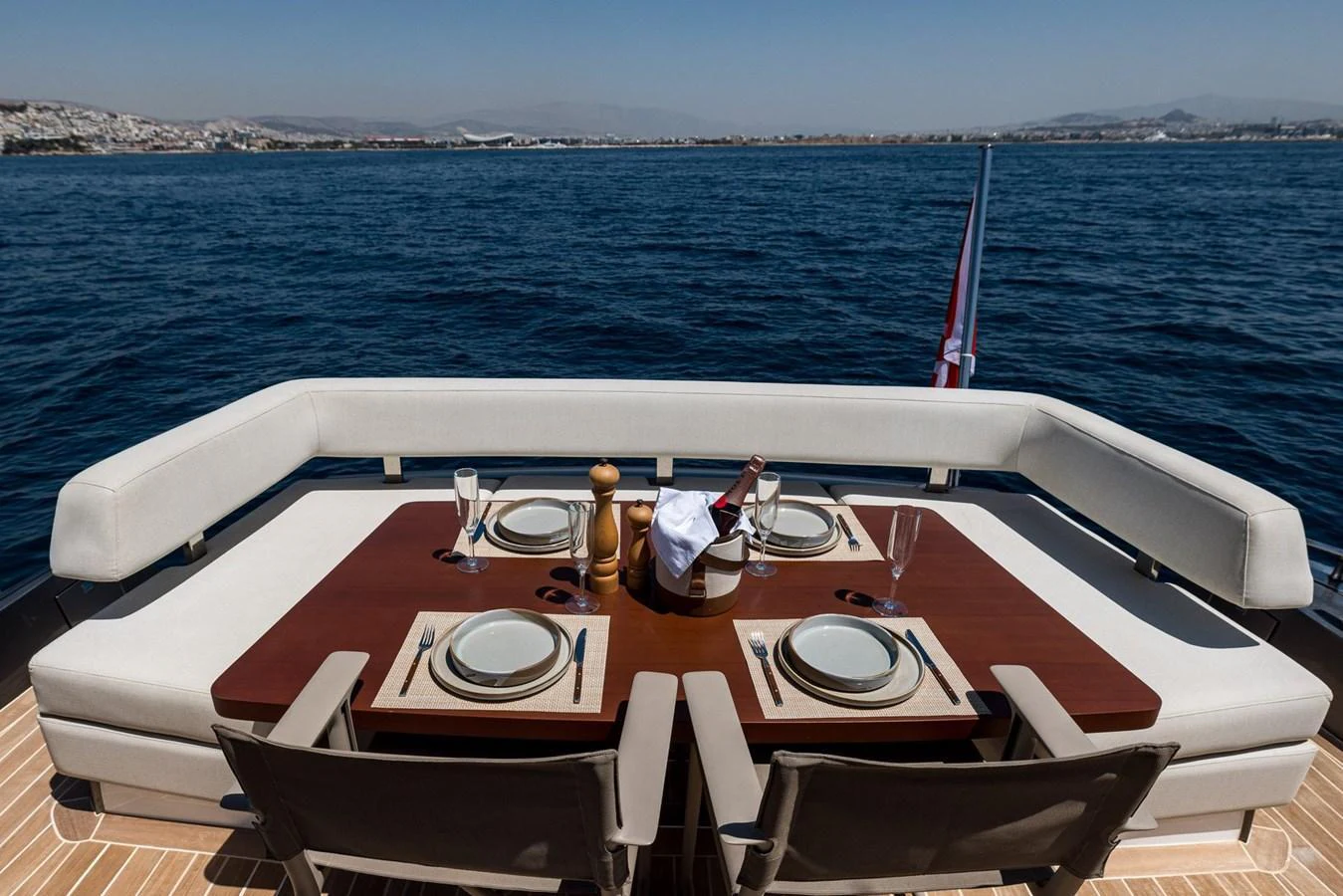 The aft deck features an elegant dining area with a stunning view of the sea. aboard LIONESS Yacht for Sale