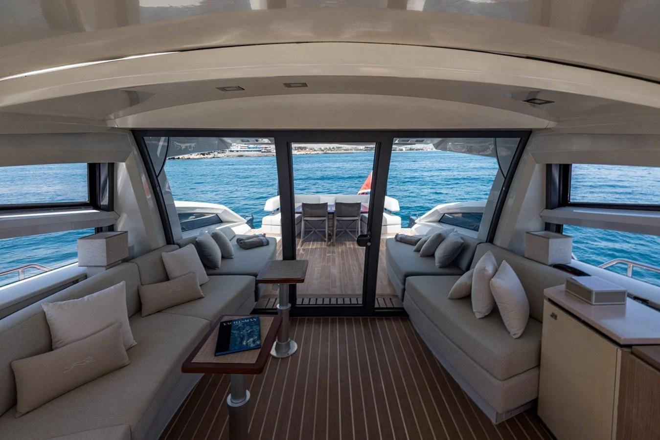 The salon offers a spacious and comfortable seating area with a stunning view of the sea through large windows. aboard LIONESS Yacht for Sale