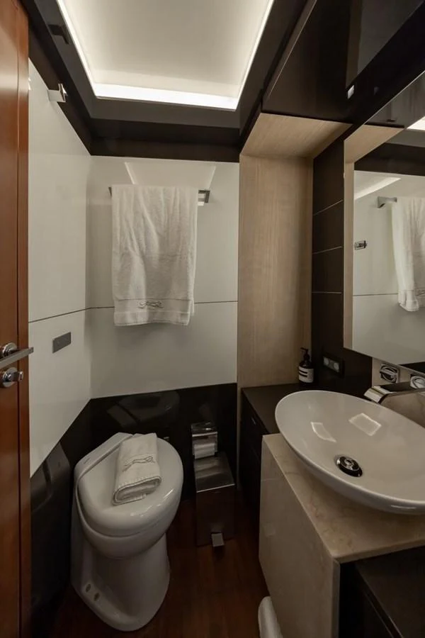 A modern yacht bathroom featuring sleek fixtures and a contemporary design. aboard LIONESS Yacht for Sale