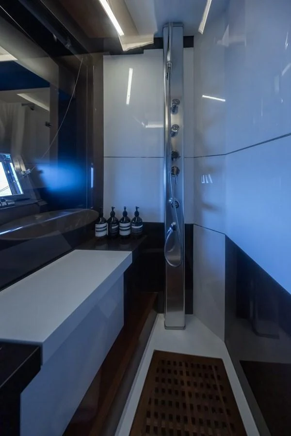 A sleek and modern bathroom with a luxurious shower area. aboard LIONESS Yacht for Sale