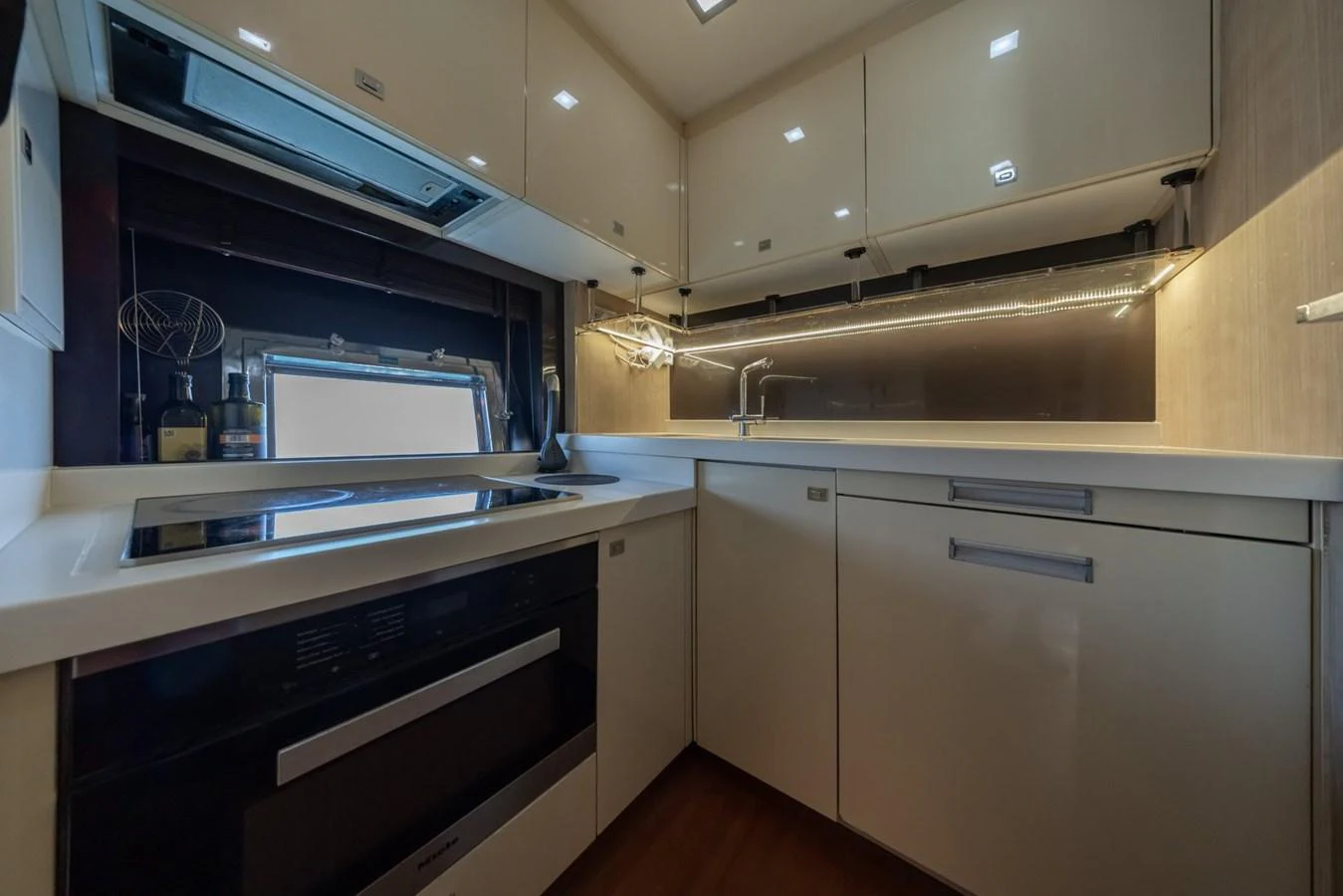 The yacht's galley features modern appliances and sleek cabinetry, creating a functional and stylish cooking space. aboard LIONESS Yacht for Sale