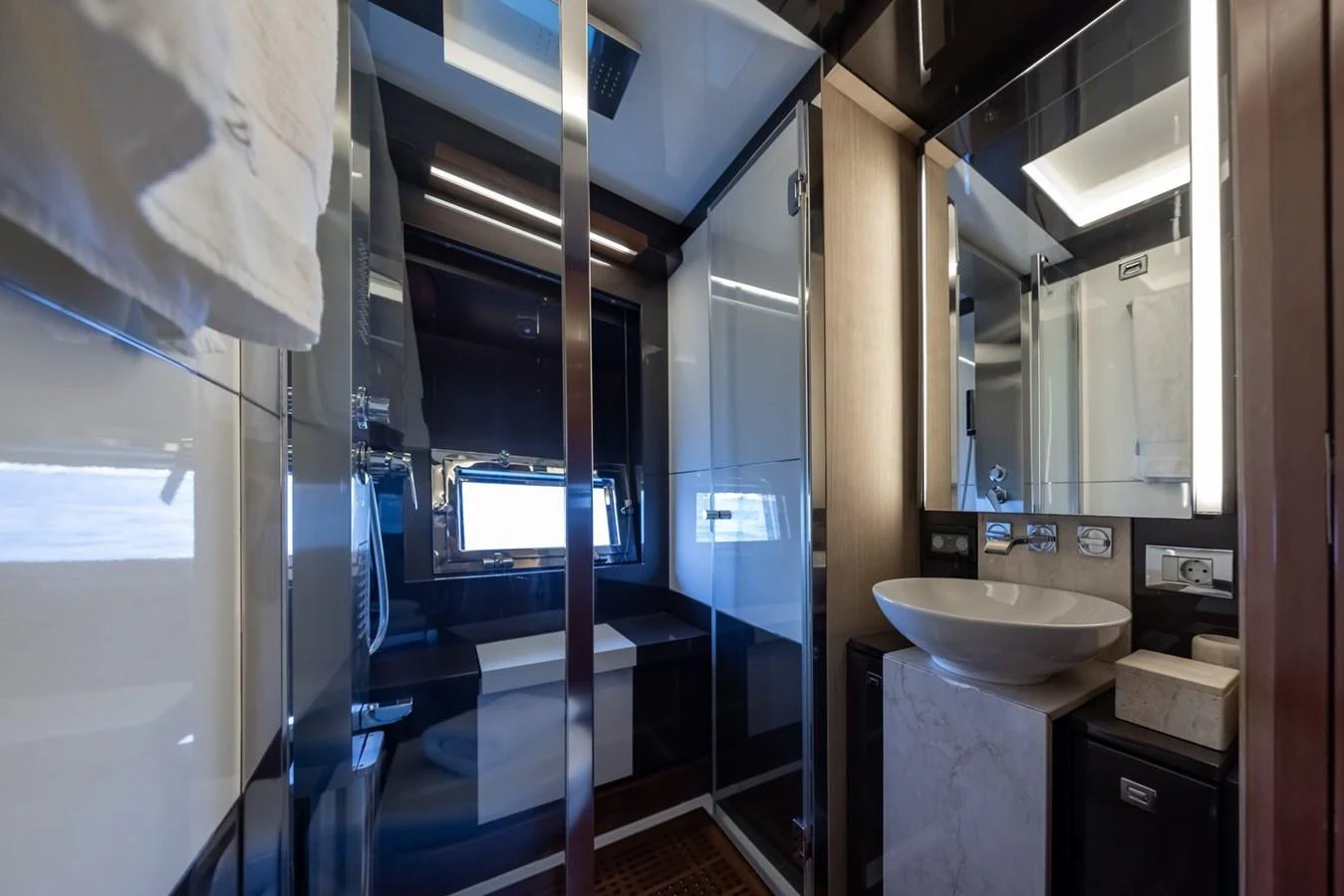 The yacht's bathroom features modern fixtures and a sleek design. aboard LIONESS Yacht for Sale