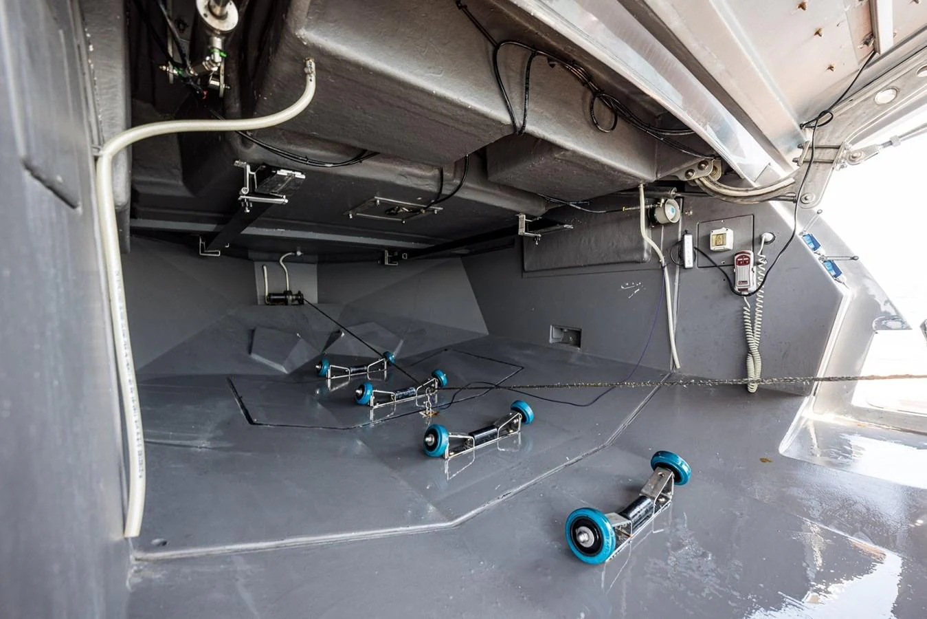 The image shows a detailed view of the yacht's technical compartment with various mechanical components and equipment. aboard LIONESS Yacht for Sale