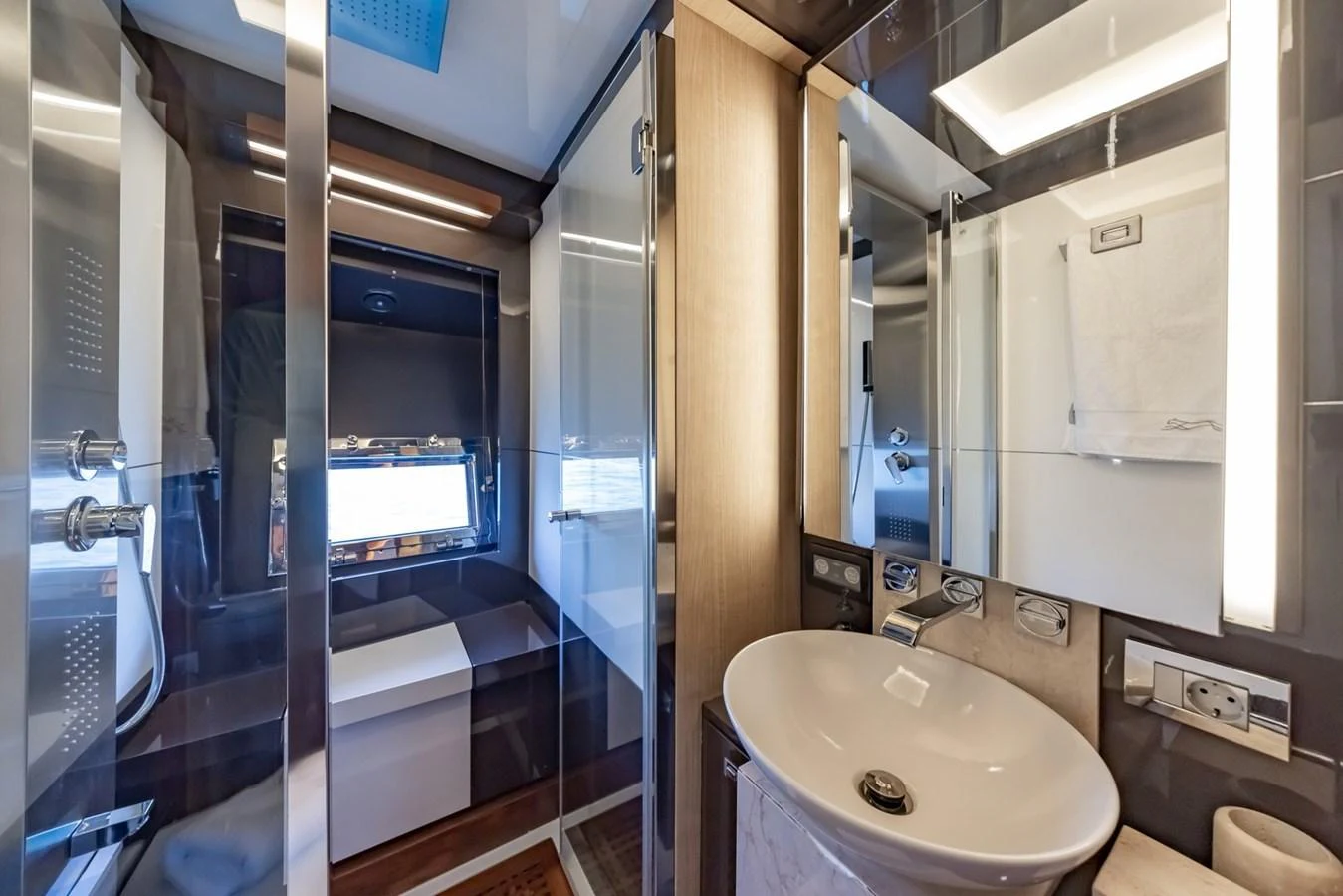 The yacht's bathroom features modern fixtures and a sleek design. aboard LIONESS Yacht for Sale