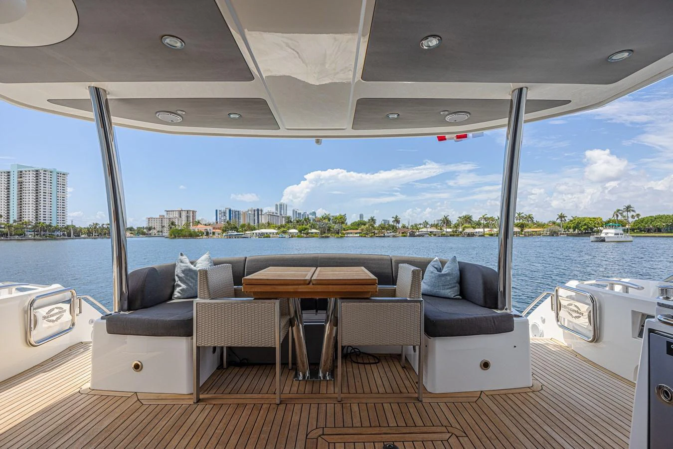 The aft deck offers a spacious and inviting area for alfresco dining with stunning waterfront views. aboard DIRTY DAWG Yacht for Sale