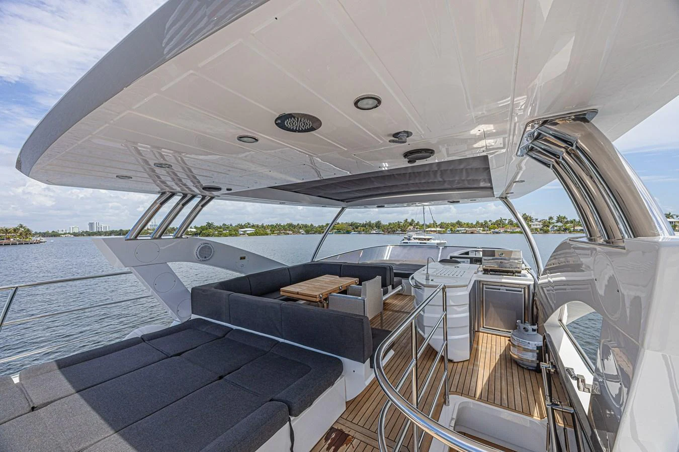 The flybridge offers a spacious and luxurious outdoor area with ample seating and a well-equipped kitchenette. aboard DIRTY DAWG Yacht for Sale