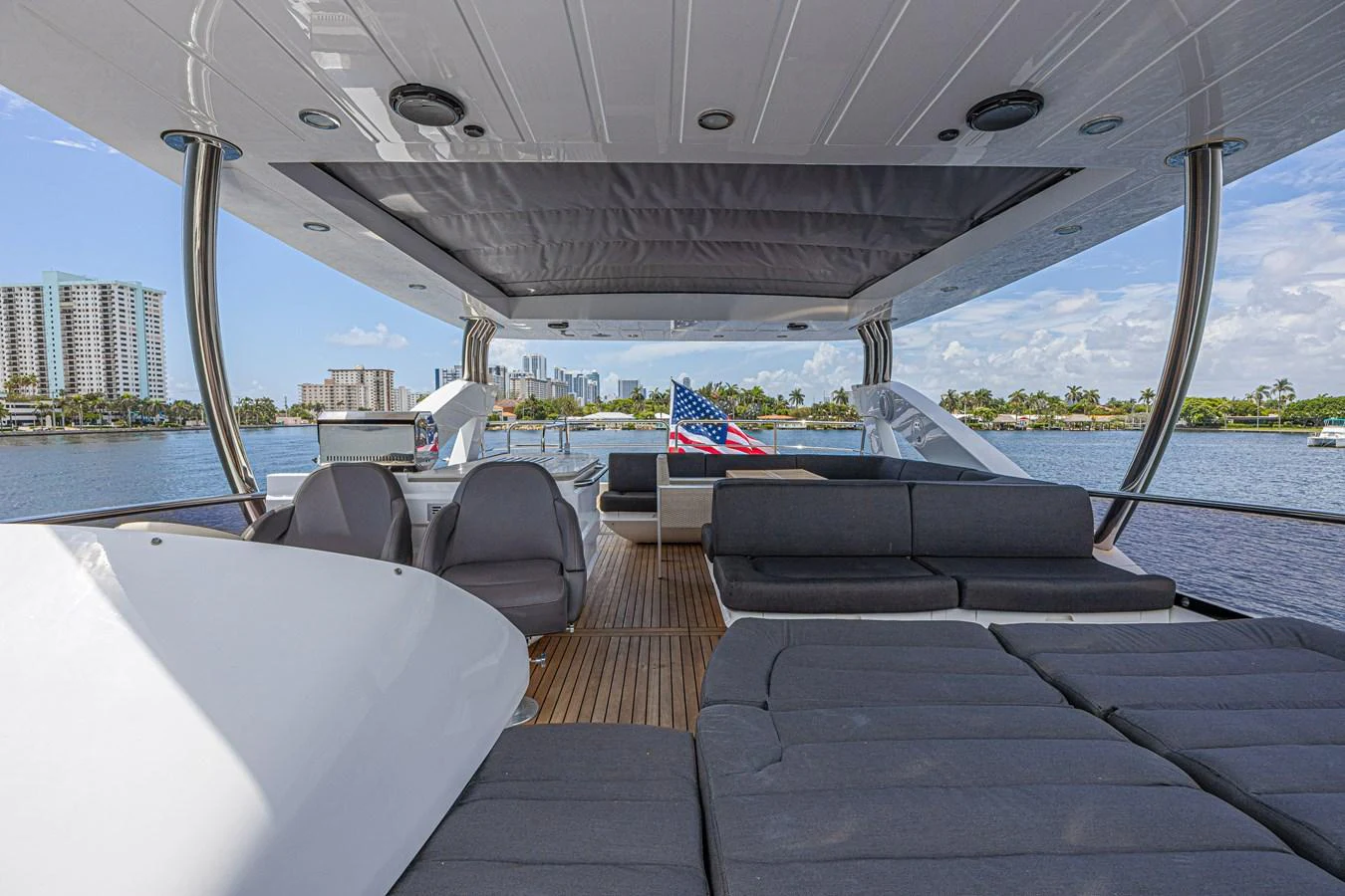The flybridge offers a spacious and comfortable lounging area with panoramic views. aboard DIRTY DAWG Yacht for Sale