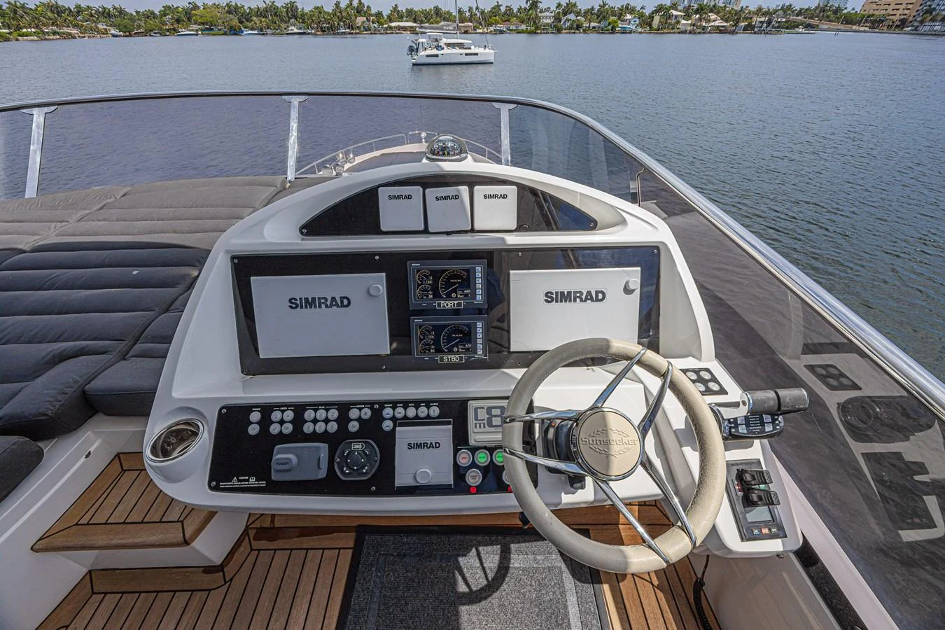 The helm station offers advanced navigation equipment with a panoramic view of the water. aboard DIRTY DAWG Yacht for Sale