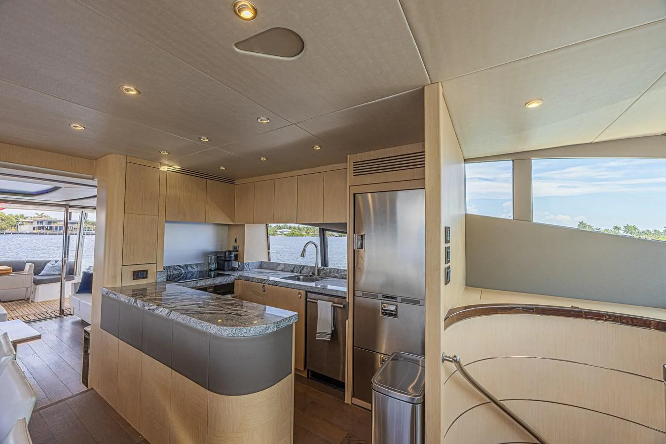 The yacht's galley features modern appliances and ample counter space, seamlessly blending with the open-plan layout. aboard DIRTY DAWG Yacht for Sale