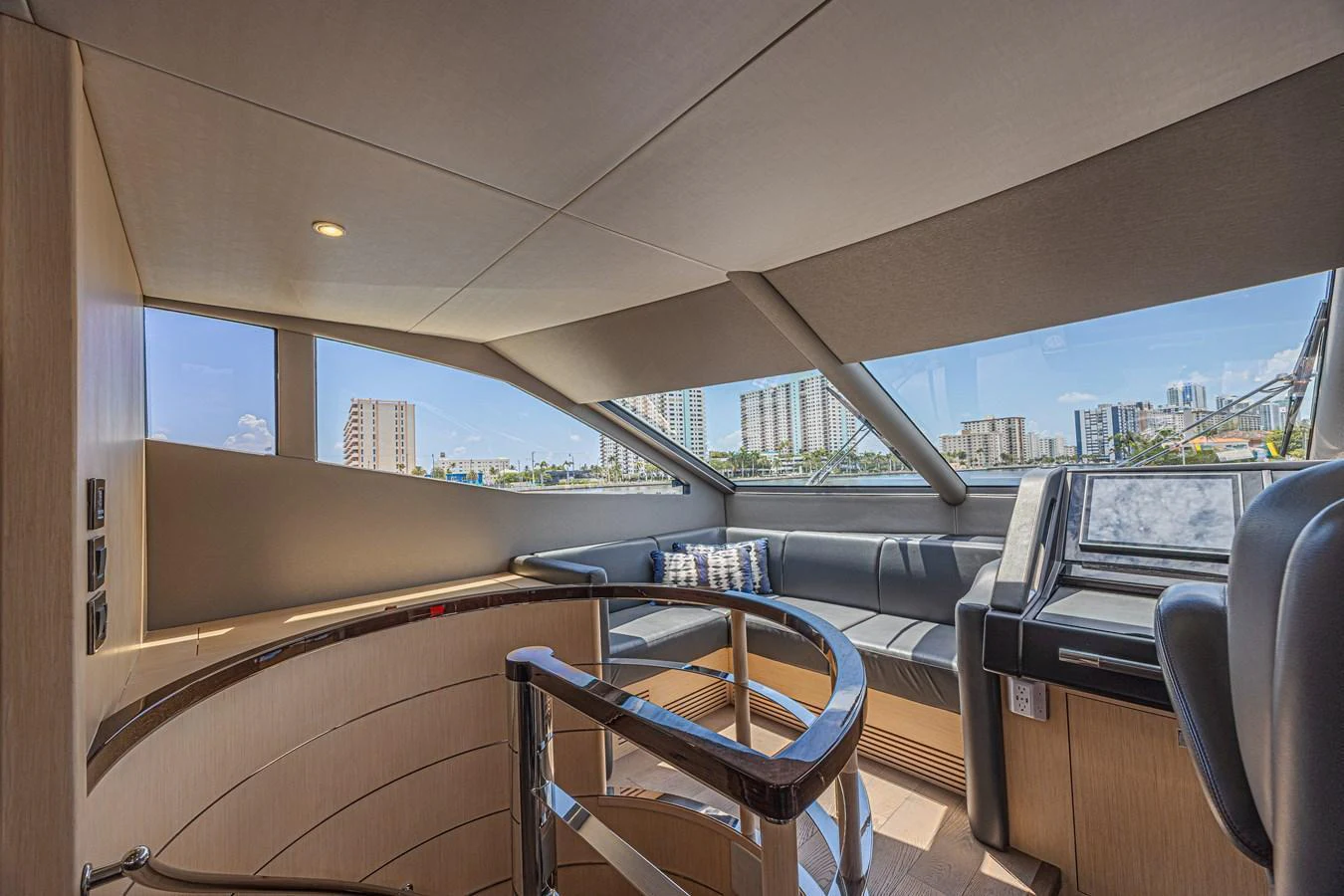 The helm area offers a sleek and modern design with panoramic views and comfortable seating. aboard DIRTY DAWG Yacht for Sale