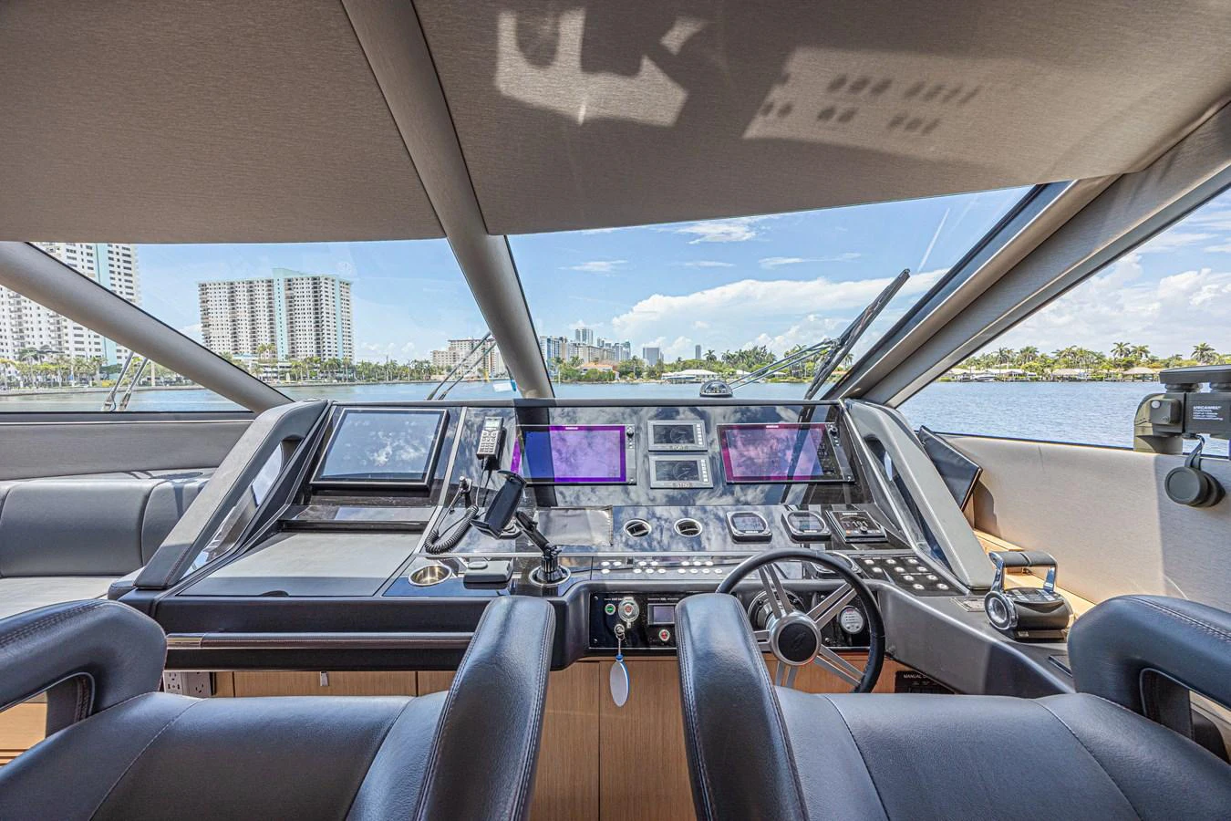 The helm station offers a panoramic view with state-of-the-art navigation equipment. aboard DIRTY DAWG Yacht for Sale
