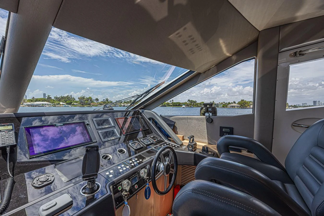 The helm station offers a commanding view with state-of-the-art navigation equipment and luxurious seating. aboard DIRTY DAWG Yacht for Sale