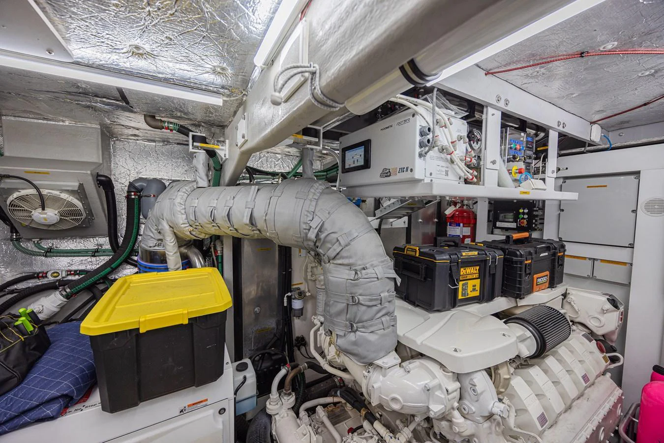 The image showcases the yacht's well-organized engine room with advanced machinery and equipment. aboard DIRTY DAWG Yacht for Sale
