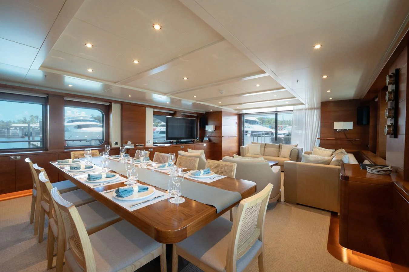 The spacious salon features elegant dining and comfortable lounging areas with ample natural light. aboard BELUGA Yacht for Sale
