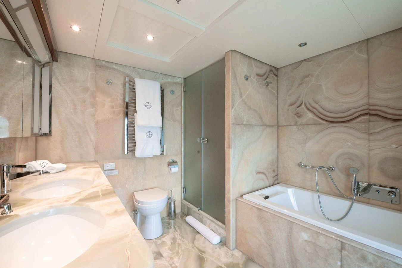 The yacht's bathroom features luxurious marble finishes and modern fixtures. aboard BELUGA Yacht for Sale