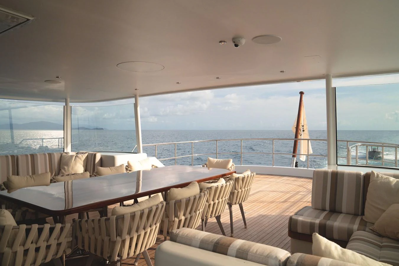 The aft deck offers a spacious and inviting area with ample seating and stunning ocean views. aboard BELUGA Yacht for Sale